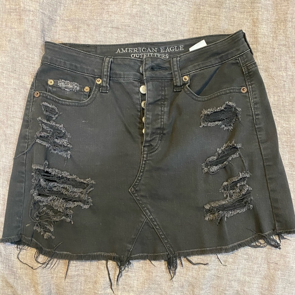 Black ripped jean mini skirt